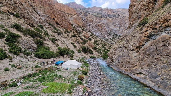 A hotel tent surrounded by extensive vegetable gardens. Some valleys are more conducive to crop production and gardening than others.