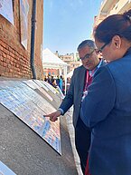 Several teachers are discussing local variations and traditions of games at Bhaktapur Mahotsav. 