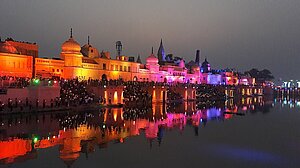 View of colourfully illuminated housefronts of Ayodhya at night