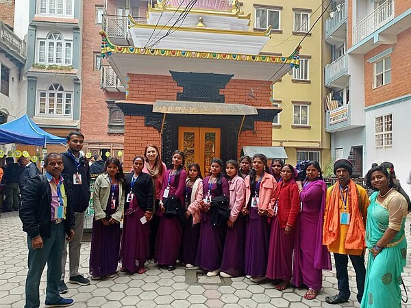 Monica Mottin (fifth from left) poses with the Mithileshwar Jhijhiya group after their performance in Echoes in the Valley.