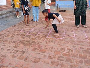 Kids playing Ghwai in the courtyard of Bode.