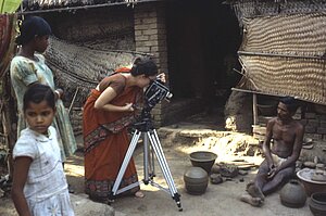 Cynthia Cunningham Cort preparing to film potter Hata Bishoi making pots. Tikarapada, 1980.