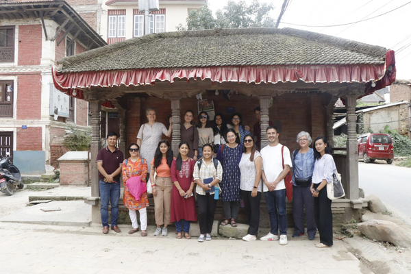 Padma Maharjan (far left) and Sabina Tandukar (front row, fourth from left) lead the HaP team and summer school participants in a workshop on heritage activism in Sunaguthi, including efforts to compat road-widening initiatives. Photo:  © Monalisa Maharjan. 